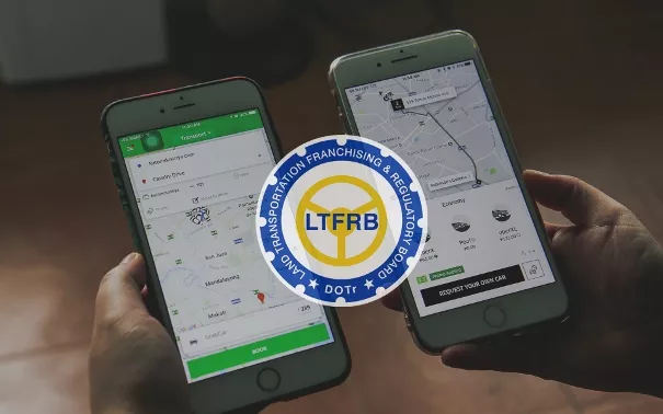 two smartphones running Uber and Grab app 