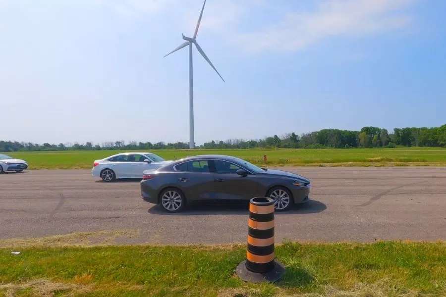 A picture of the Mazda3 and Honda Civic racing against each other.