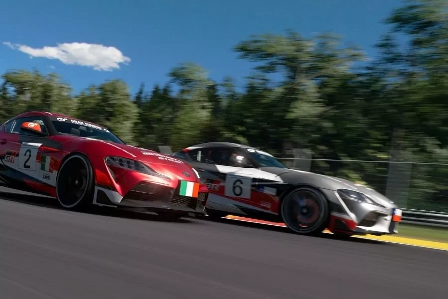 A picture of two Toyota Supras racing in Gran Turismo Sport
