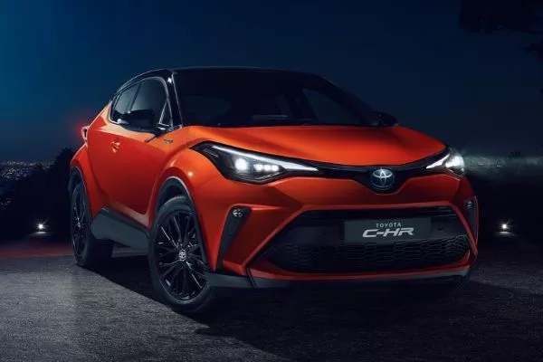 A picture of an orange Toyota C-HR in the dark