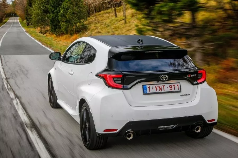 A picture of the rear of the Toyota GR Yaris as it travels on a country road.