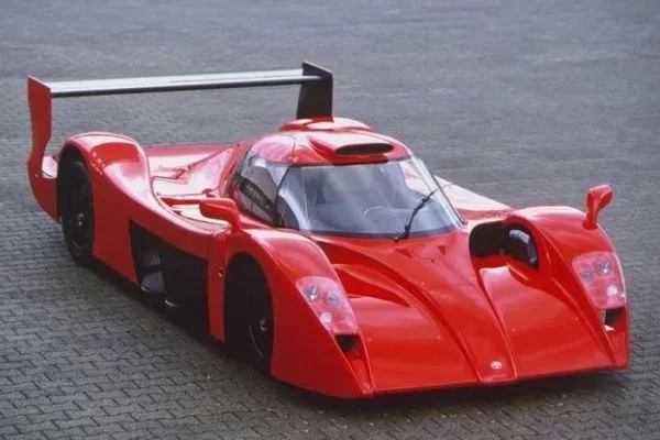 A picture of the Toyota GT-One parked on a cobbled road