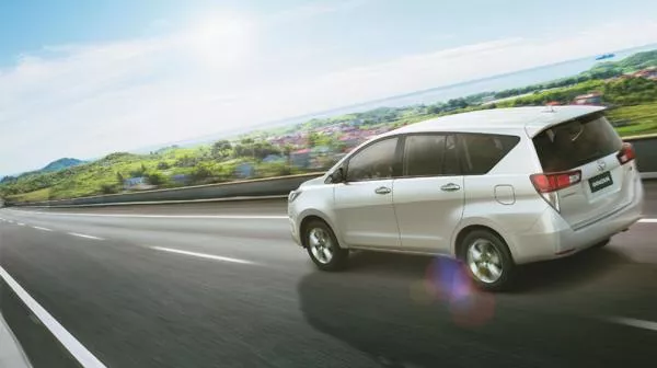 A silver Toyota on the road