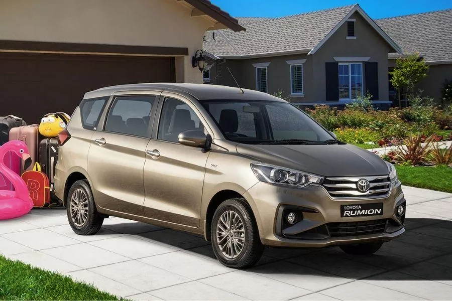 A picture of the Toyota Rumion parked in front of a house