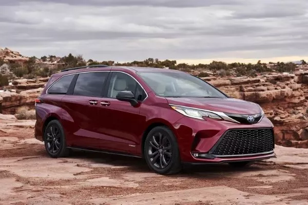 A picture of the Toyota Sienna hybrid near some rock formations