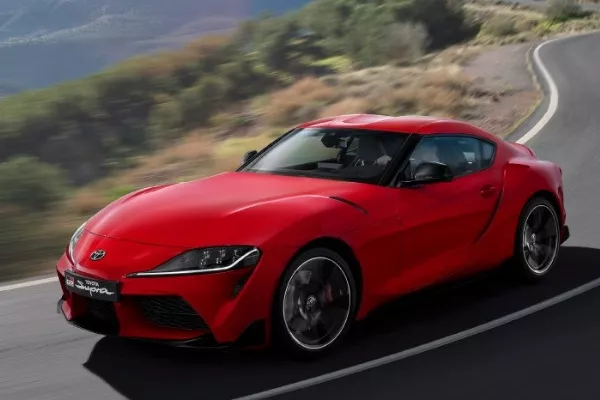 A red Supra on the road