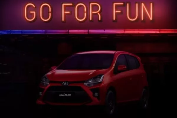 A Toyota Wigo in dim lighting