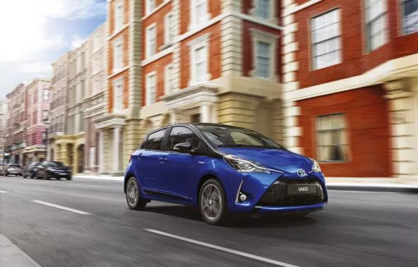 A blue Toyota Yaris on the road