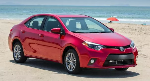 Angular front of a red Toyota Corolla