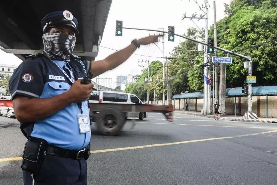 Manila traffic light with a traffic enforcer