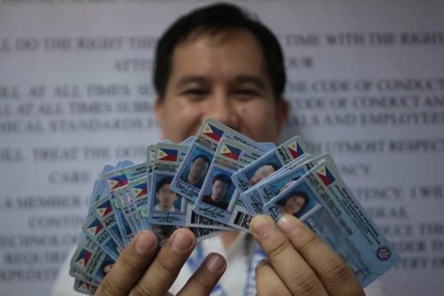 Man holding licenses