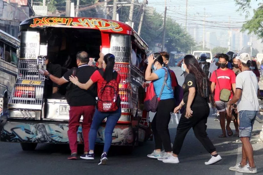 Passengers boarding jeepney