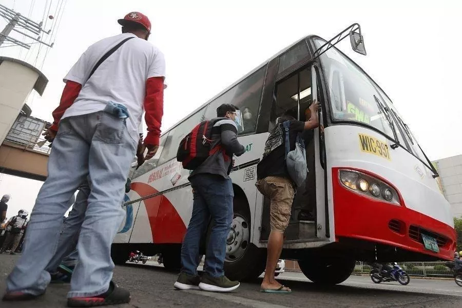 Commuters entering bus in the Philippines