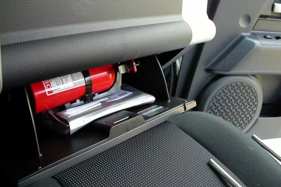 Fire extinguisher in glove box