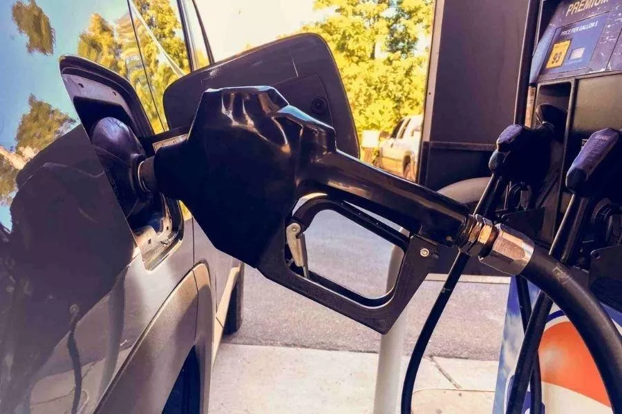 A picture of a fuel pump filling up a car.