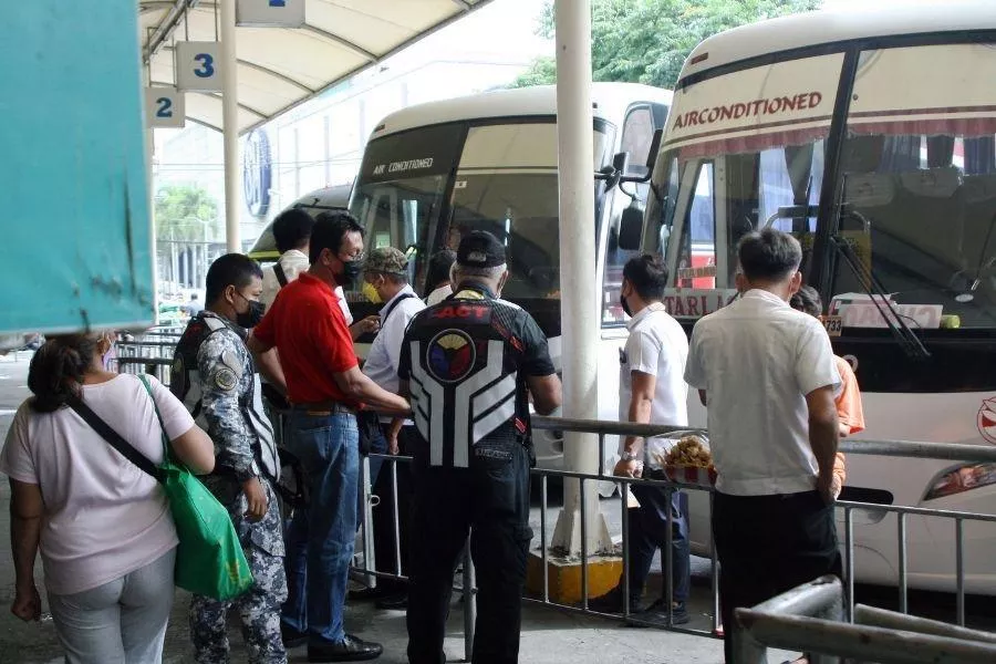 Passengers at bus terminal