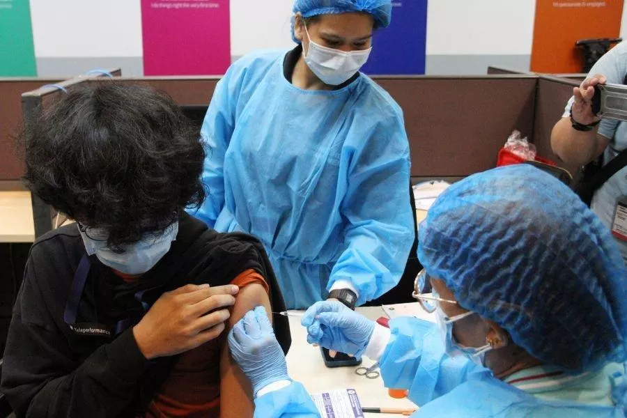 Doctor giving vaccine Doctor giving vaccine