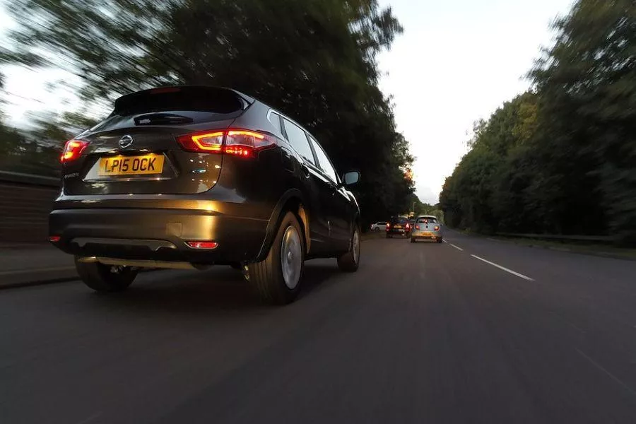 Cars speeding on road 