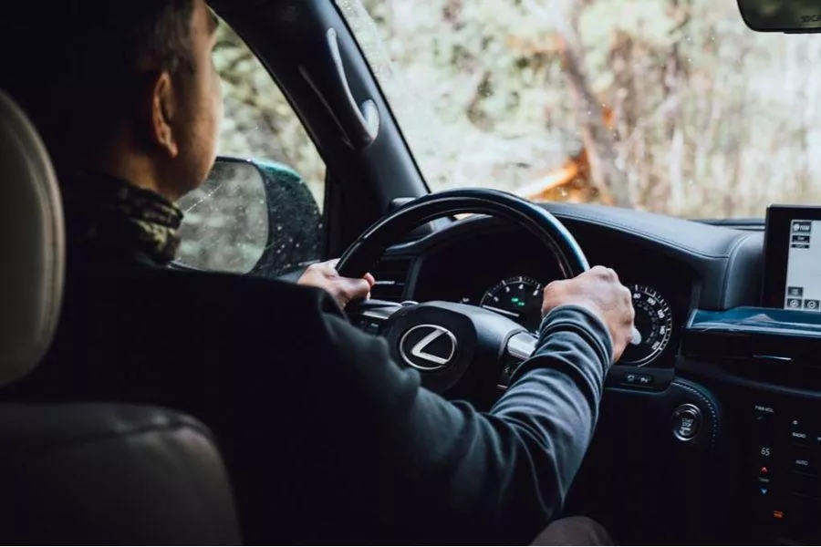 Driver in Lexus cockpit