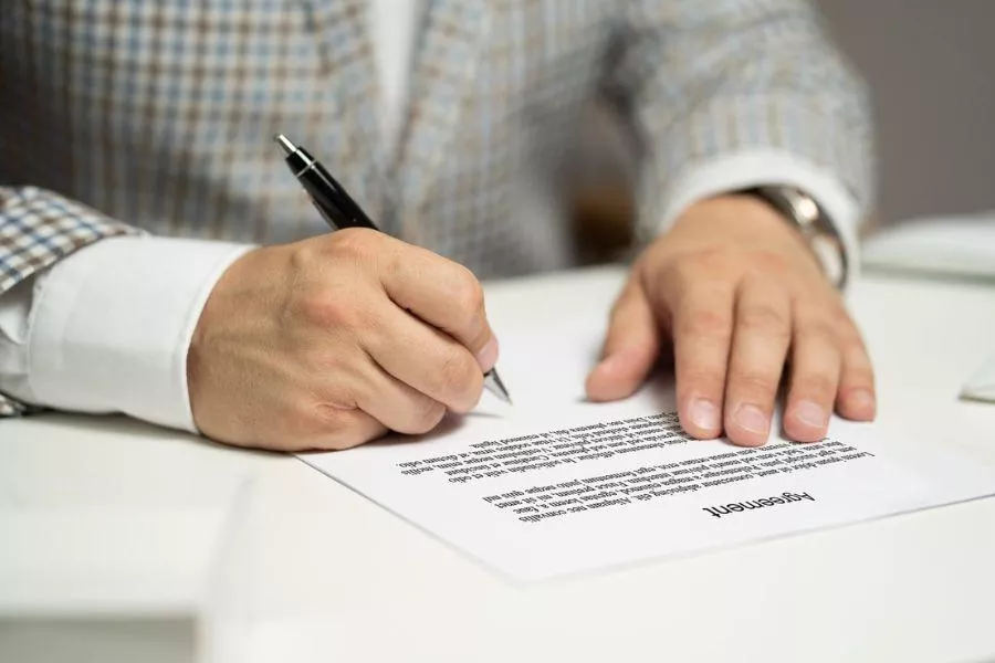 Man signing contract 