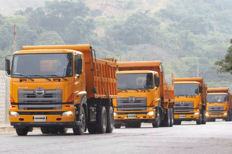 Row of Hino dump trucks 