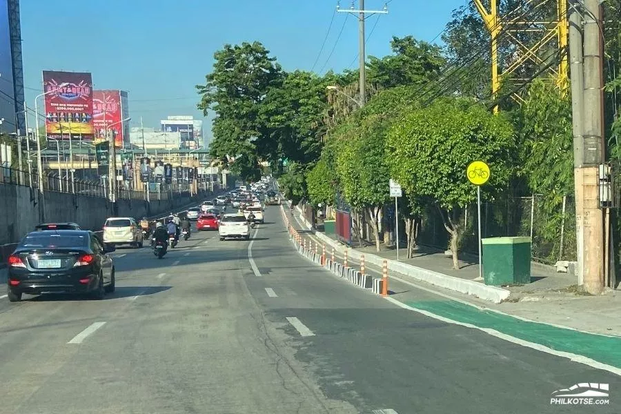 A picture of a road with bike lanes.