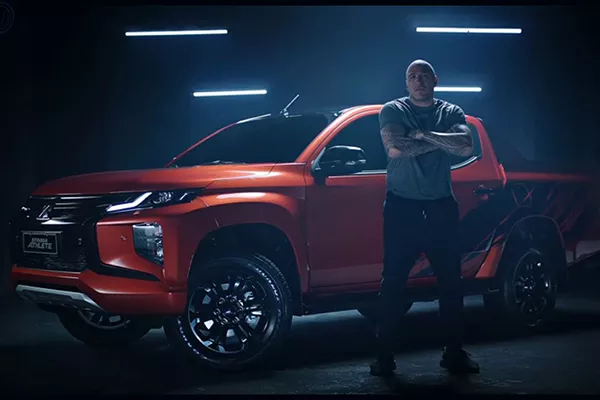 Brandon Vera standing near the Mitsubishi Strada Athlete
