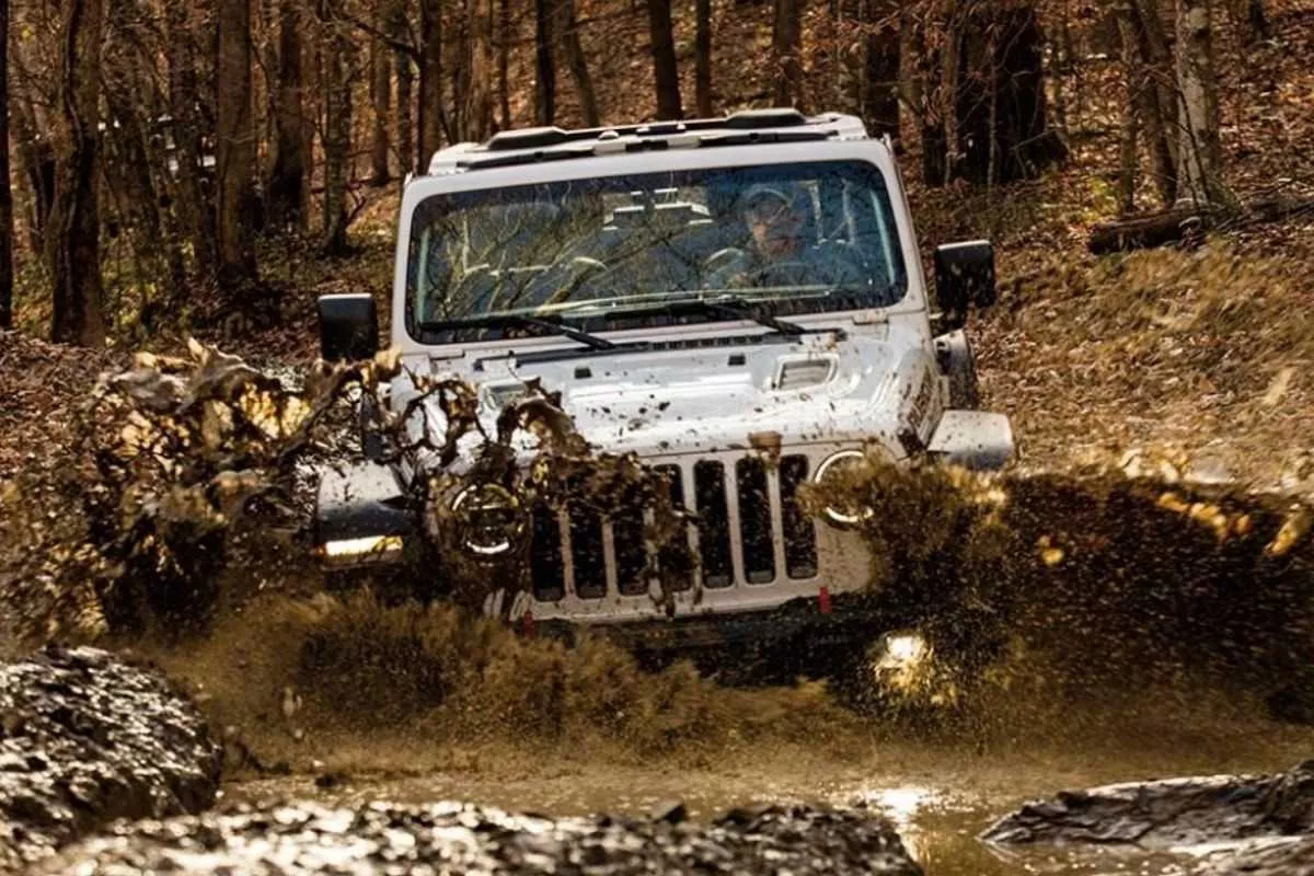 A picture of a Wrangler dealing with mud