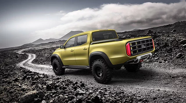 A yellow Mercedes-Benz X-Class on the road