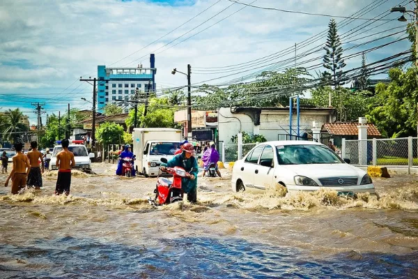 Flooded street with vehicles