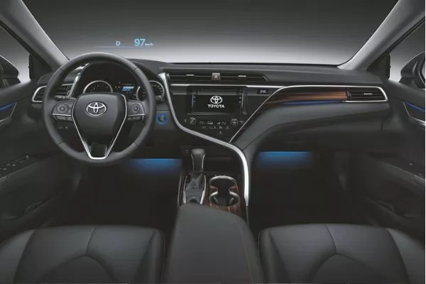 We really appreciate the irregular, asymmetrical shape surrounding the touchscreen unit A picture of the Toyota Camry's interior.