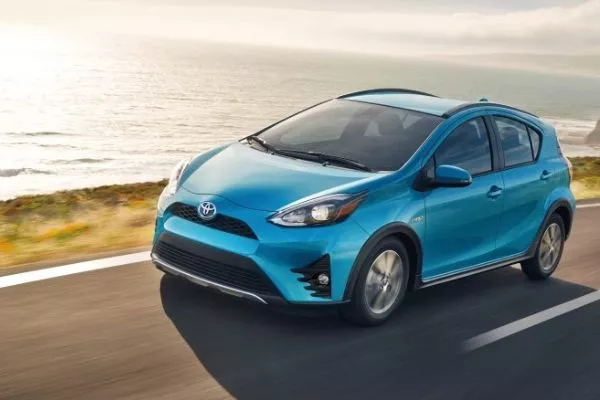 A picture of the Toyota Prius C travelling on a road.