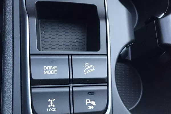 Button to activate the downhill assist control (DAC) DAC