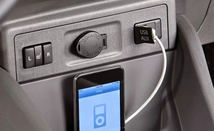 A smartphone is being charged in car