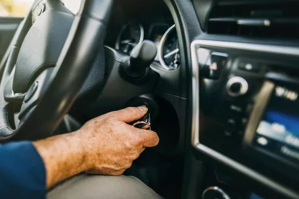 A faulty ignition switch may be providing your car accessory with the power Man starting the car