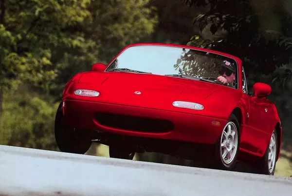 a red MX-5 NA Miata