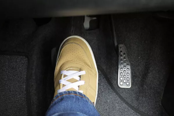 Man stepping on the brakes