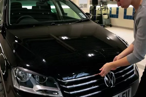 Man opening the car hood