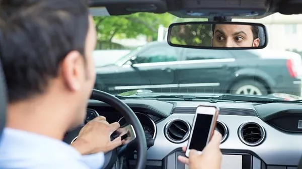 A picture of a distracted driver