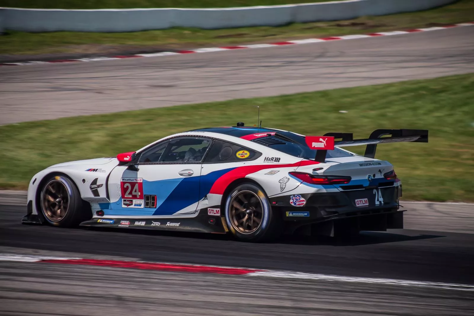 A BMW M8 on a track