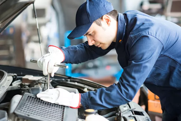 Mechanic inspecting a car
