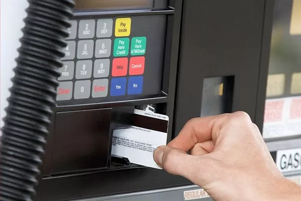 Man paying for gasoline