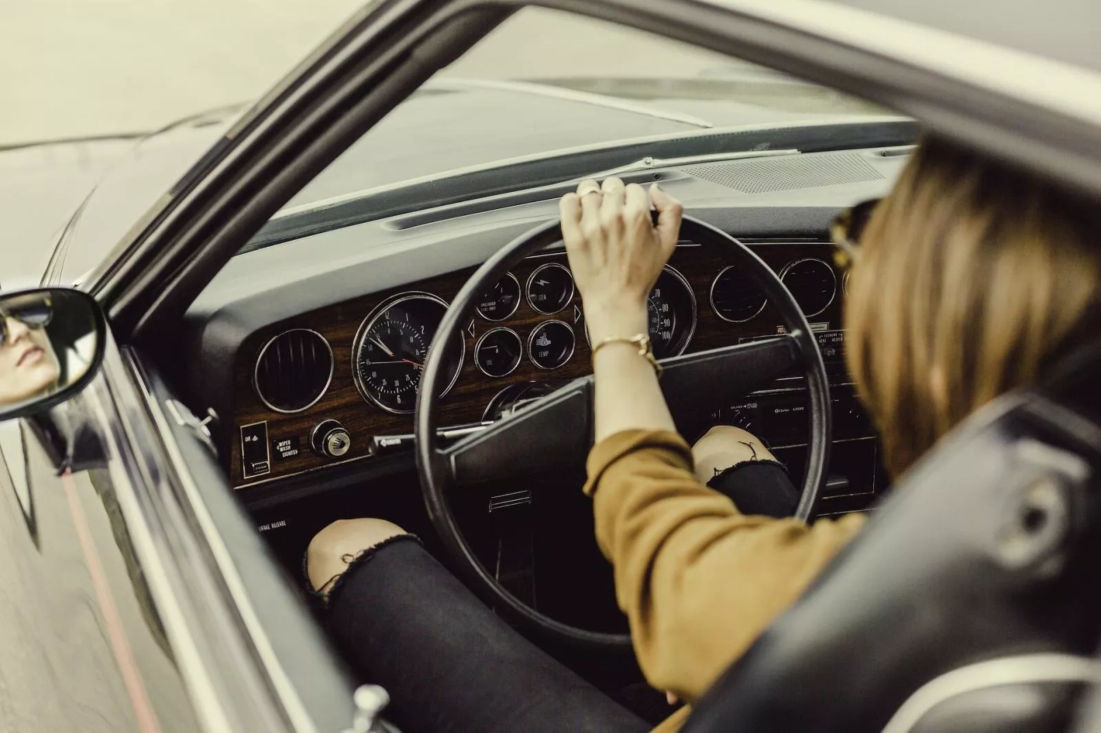 The first cruise control was invented way back in 1948 Woman driving a car