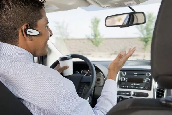 A man using a Bluetooth headset