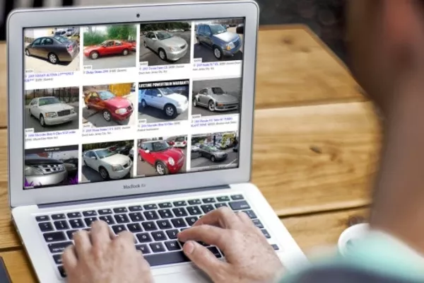 Most millennials who want to buy a vehicle first browse the internet before actually visiting a dealership Man using a laptop