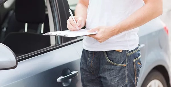 Man assessing the car