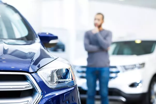 A man thinking after buying a car