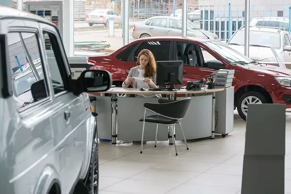 Woman in the car dealership