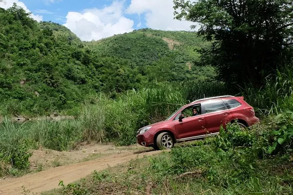 A cars going off road through a rough