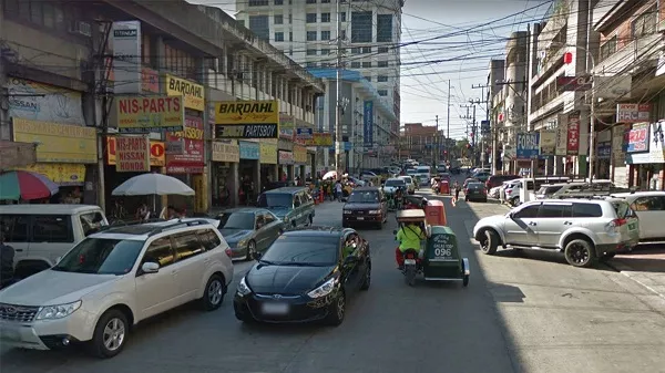 Also, looking for parking spaces around this area can be a nightmare A picture of several car parts stores in Banawe, Quezon City